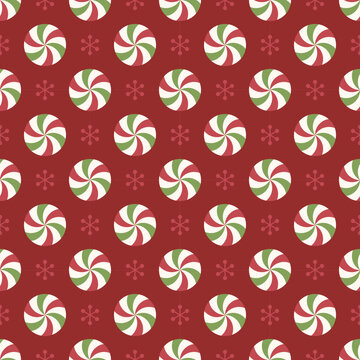 Seamless pattern with red and green peppermint candies and snowflakes.