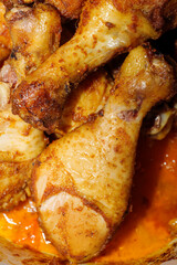 A close up of fried chicken legs, drumsticks, tasty and unhealthy food compilation. High quality photo