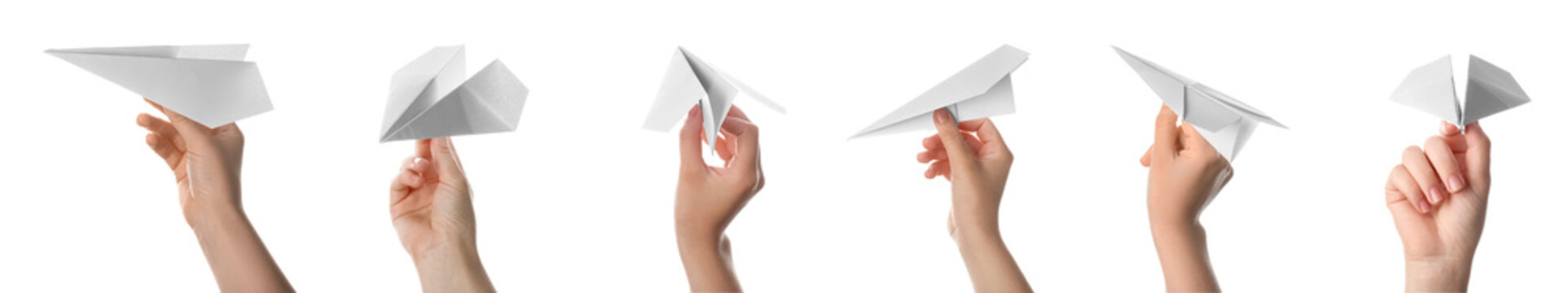 Set of hands with paper planes on white background