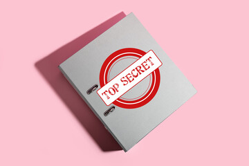 Folder with top secret documents on pink background