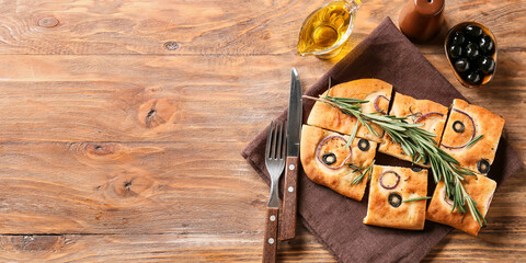 Traditional Italian Focaccia on wooden background with space for text