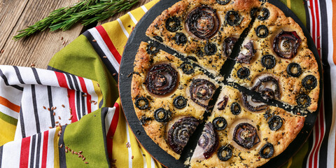 Plate with tasty Italian focaccia on table