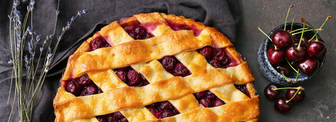 Delicious cherry pie on dark grey table, top view © Pixel-Shot