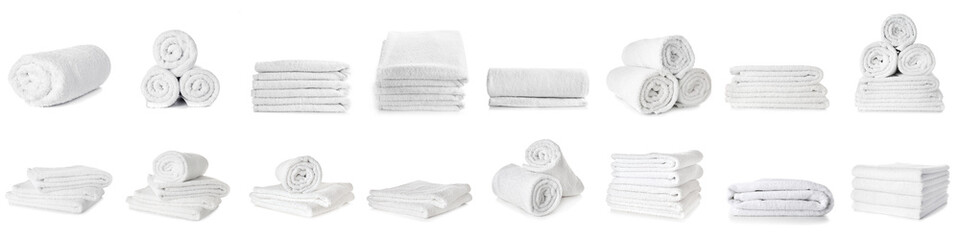 Set of clean soft towels on white background