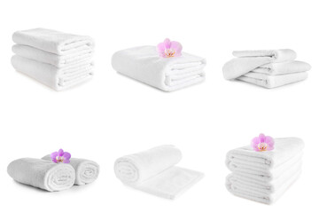 Set of clean soft towels isolated on white