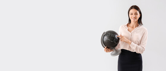 Female Geography teacher on light background with space for text