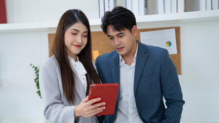 asian couple working at office