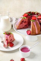 Dessert stand with tasty strawberry cake and sauce on light background