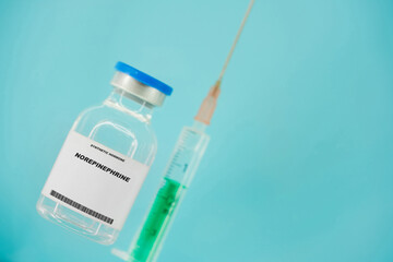 Norepinephrine. Test tube with artificial hormone on pink background Norepinephrine