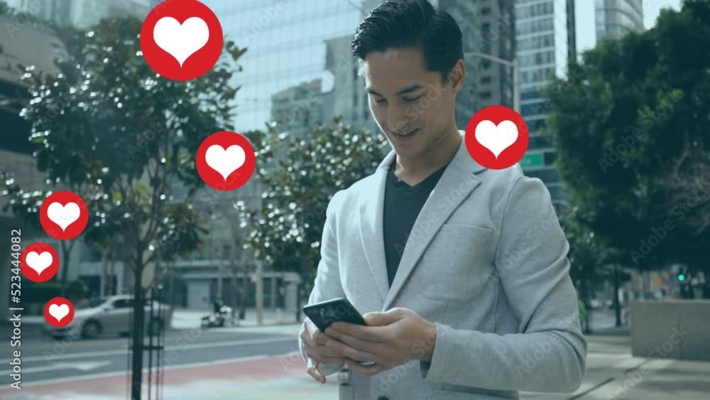 Poster animation of heart shapes floating over biracial businessman using smartphone while standing on road