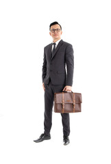 Full-length portrait of businessman handing briefcase, isolated on white. Concept of business and success