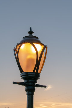 Old street lamp on blue sky