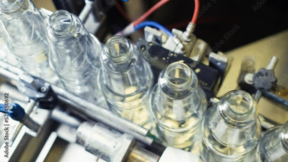 Poster beverage production process.robotic automation line for bottling juice into glass bottles.4k
