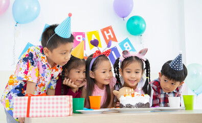 Group of asian children at birthday party , children look for to eat  birthday cake.