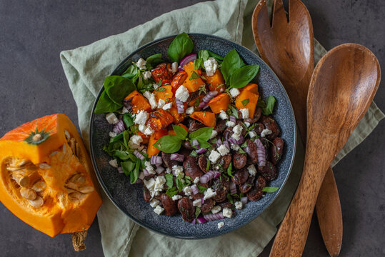 Healthy vegan salad vegetables with pumpkin and black beans