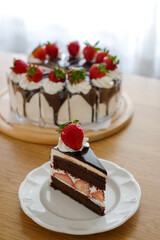 Chocolate cake with strawberry and whipping cream. Homemade bekery concept.