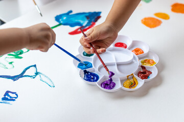 Child paint with watercolors. Education concept.
