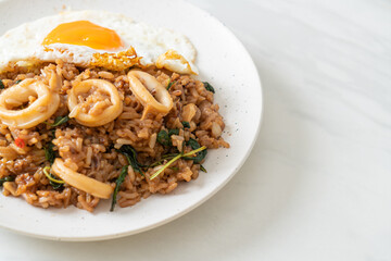 fried rice with squid and basil topped fried egg in Thai style