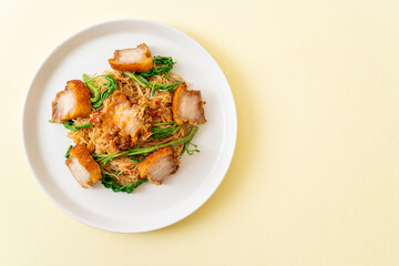 Stir-fried rice vermicelli and water mimosa with crispy pork belly
