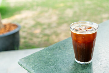 iced americano coffee glass on table