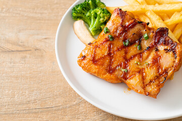 grilled chicken steak with potato chips or french fries