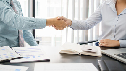Business concept, Business colleagues shaking hands together after working successfully