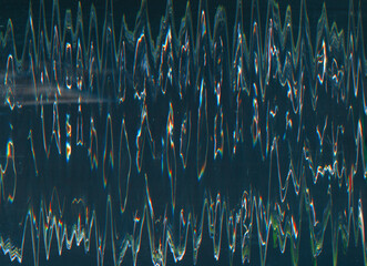 Glitch noise overlay. Old film texture. Analog distortion. Neon blue orange color vibration waves dust scratch artifacts on dark black illustration abstract background.