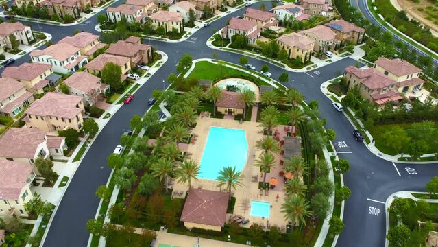 Wealthy Neighborhood in Irvine City, Orange County CA USA, Aerial View of Community Pool, Streets and Homes, Drone Shot