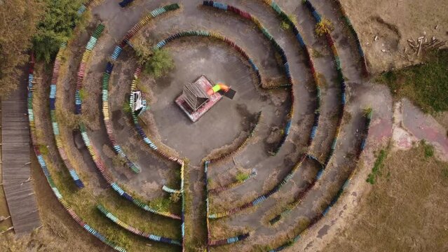 Puzzling labyrinth structured with colored wooden logs at Buenos Aires 