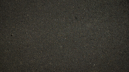 Fototapeta na wymiar texture of dark asphalt surface background 