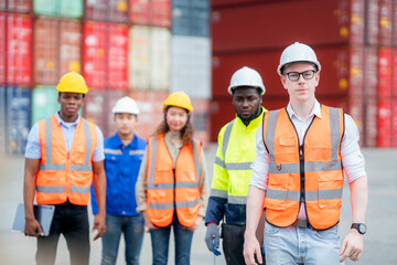 Manager standing in container depo company area
