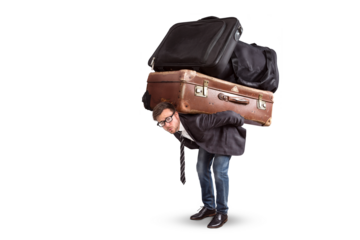 Man carrying a lot of heavy luggage on his back