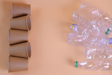 Eco-friendly paper cups vs plastic bottles. Zero waste home, plastic free concept.