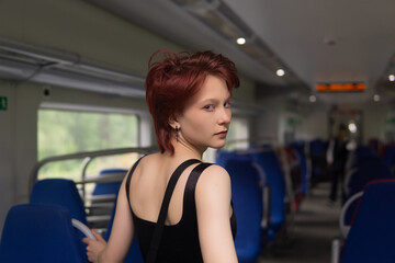 Obraz premium teenager girl in a commuter train car