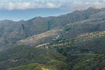 Fototapeta premium Rural landscape with mountains, fields and farms on the volcanic island of La Gomera, Canary Islands, Spain