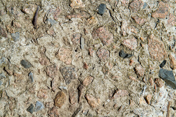 The texture of concrete with granite stones.
