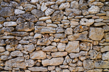 old medieval high wall pebble stones background