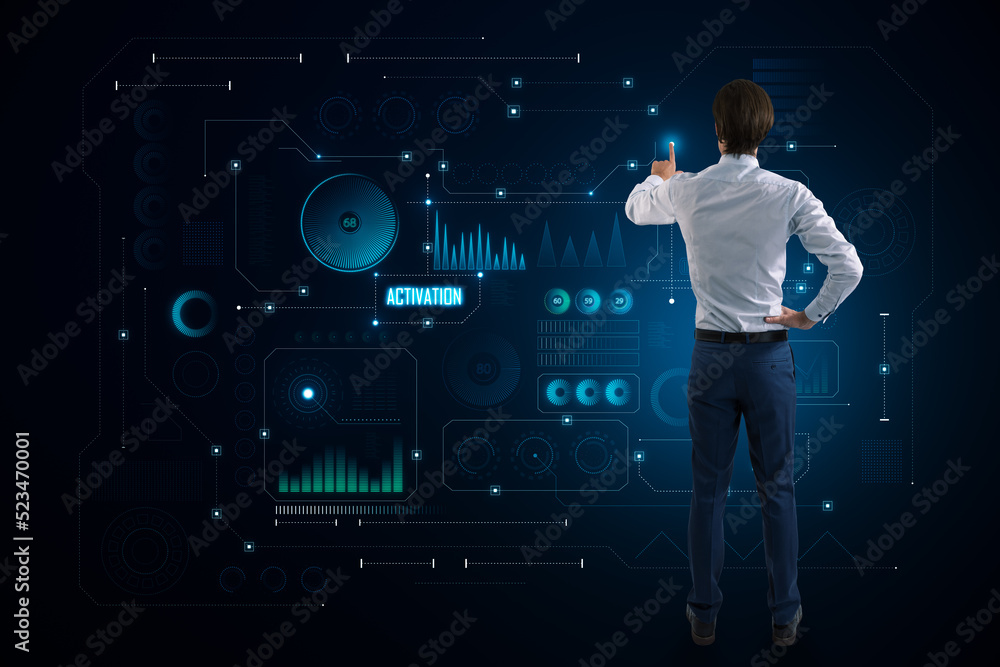 Poster Back view of young businessman using abstract glowing dark digital business interface with various icons background. Diagnistics, activation and tech data anlysis concept.