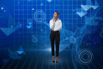 Thoughtful young european businesswoman standing on creative glowing blue metaverse background. Cyberspace, future and technology concept.