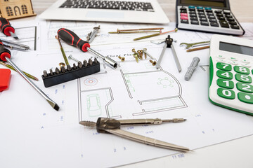 Drawing and drafting table with drawing tools spread out.