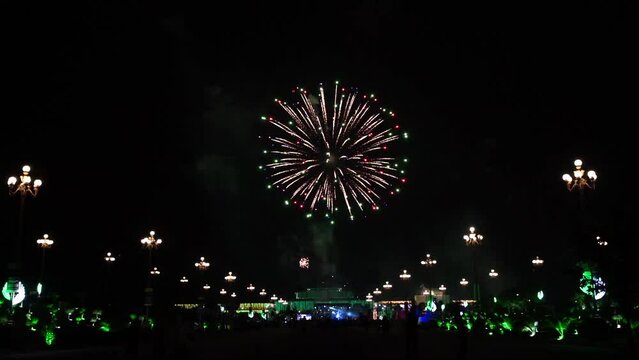 Slow Motion Colorful fireworks that explode and fill the darkness of the night sky with colored light at Parliament House of Pakistan