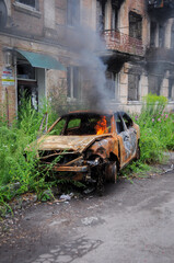 Burned car after the terror attacks a result of the Russian invasion of Ukraine. Exploded car....