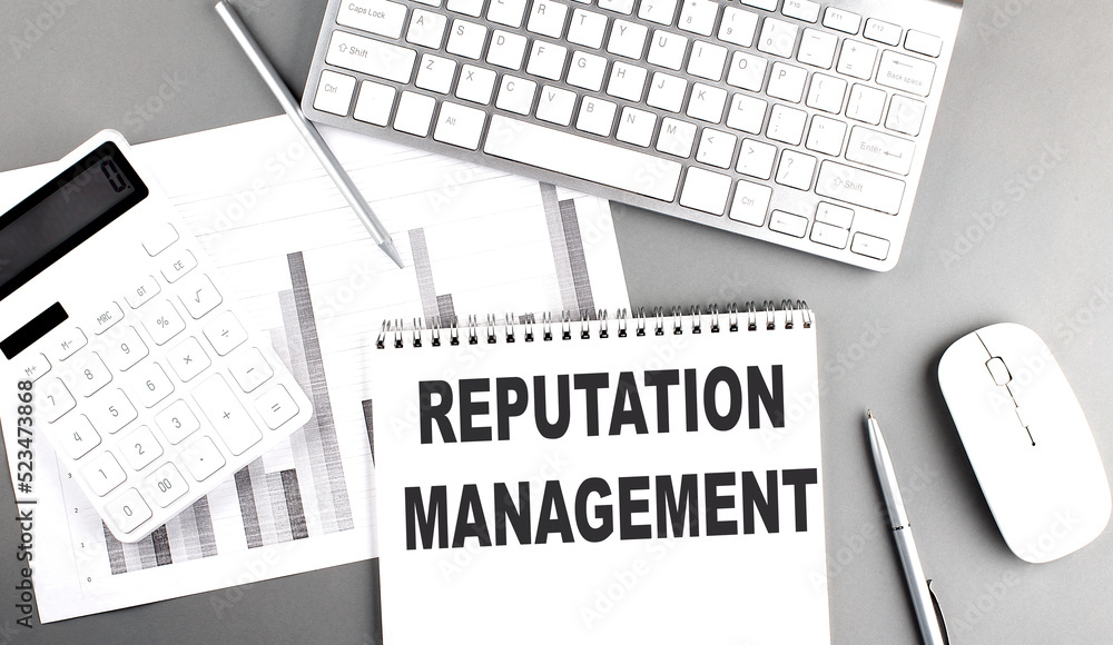 Aufkleber reputation management text written on notebook on grey background with chart and keyboard , business