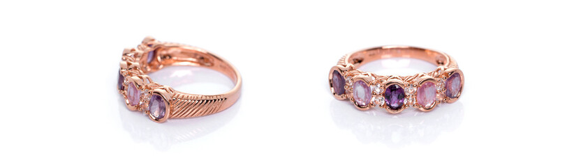 Pink and purple sapphire with  diamond Jewel or gems ring on white background with reflection. Collection of natural gemstones accessories. Studio shot