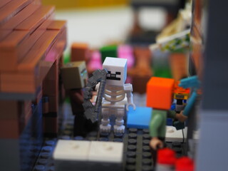 Fototapeta premium Elements and fragments of Lego village world set. Characters of electronic game Minecraft. Children's designer with small details, developing motor skills and imagination.