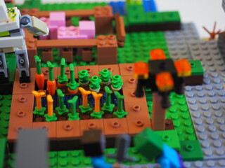 Fototapeta premium Elements and fragments of Lego village world set. Characters of electronic game Minecraft. Children's designer with small details, developing motor skills and imagination.