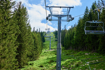 Beautiful mountains, covered with forest and open cable car line. Karpacz resort in Poland with...