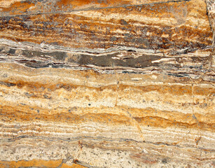 Texture of marble of yellow, brown and white color. Natural marble material