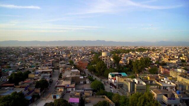 Slow Motion kite flying festival Basant in Pakistan in the evening with city from the top view