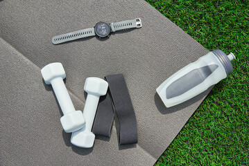 Sport items, fitness smart watches and running sneakers on gray background, Set of objects for...